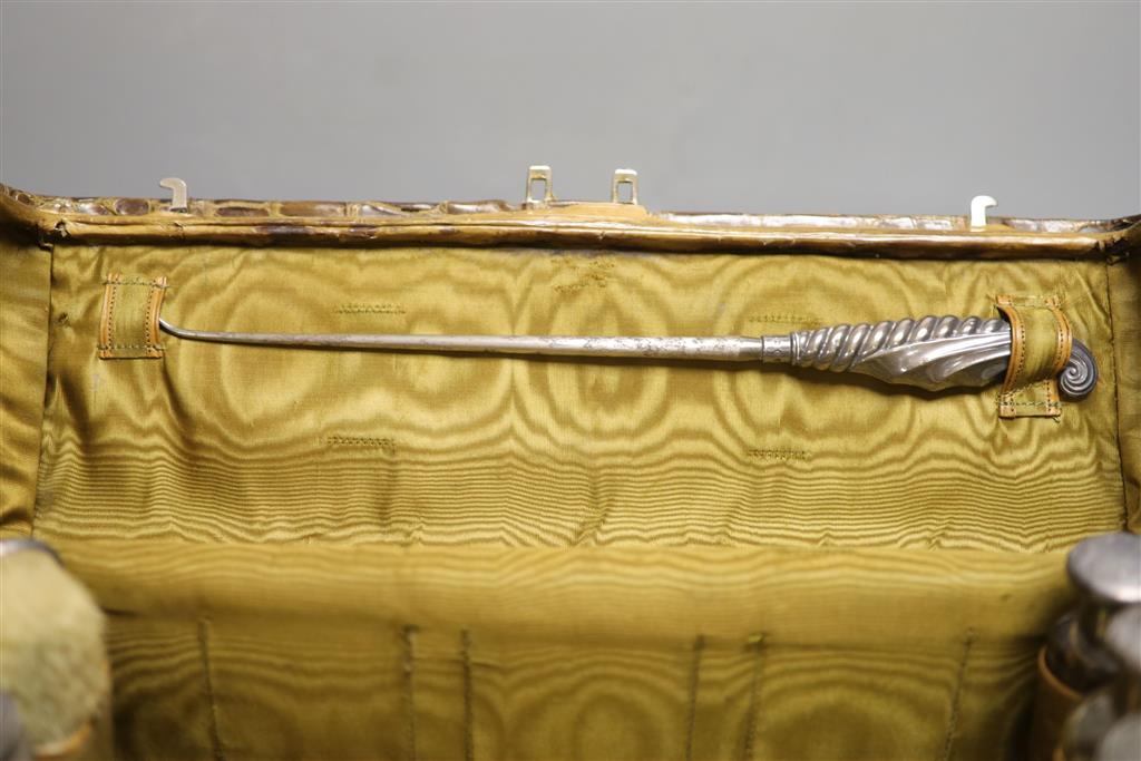 A late Victorian crocodile skin travelling toilet case